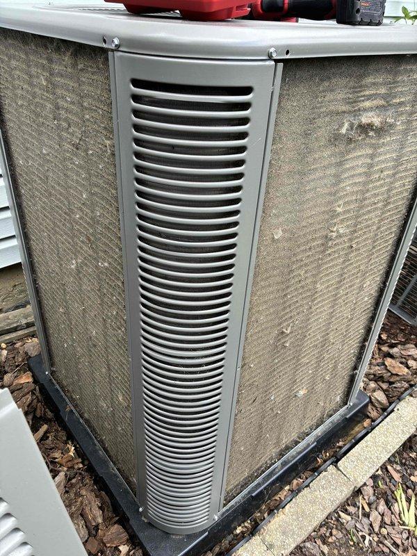 Completed MVP cooling maintenance visit on residential HVAC system. Inspected outdoor condenser unit and noted heavy accumulation of dirt, dust, and debris on side mesh filter panels restricting airflow to condenser coils. Verified indoor furnace system operation and checked condensate drainage piping configuration with proper valve installation.