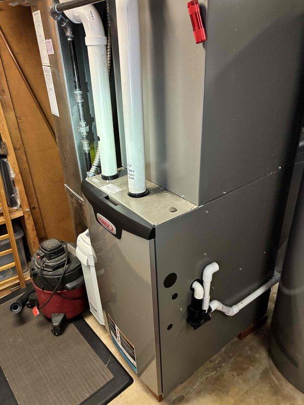 Completed MVP cooling maintenance visit on residential HVAC system. Inspected outdoor condenser unit and noted heavy accumulation of dirt, dust, and debris on side mesh filter panels restricting airflow to condenser coils. Verified indoor furnace system operation and checked condensate drainage piping configuration with proper valve installation.