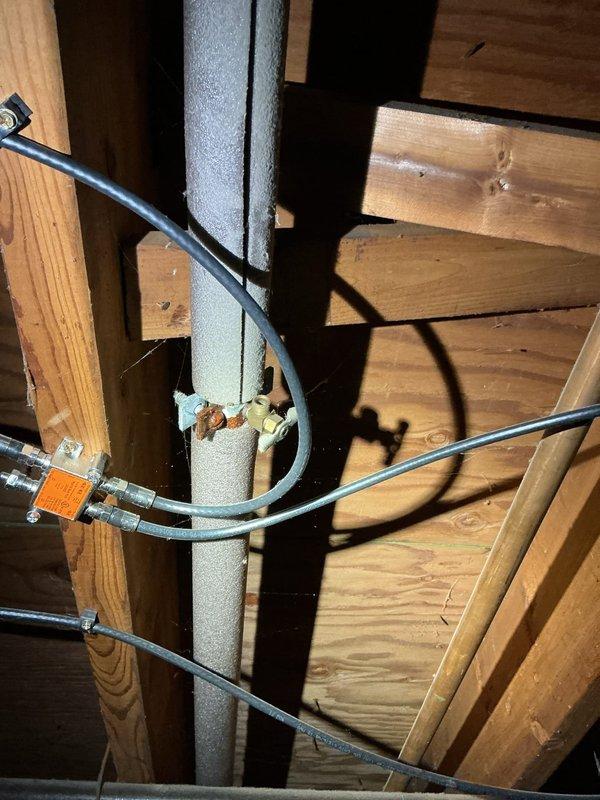 Responded to a water leak on the main waterline feeding the water softener system. The existing clamp connection had deteriorated due to rust, causing an active leak that required immediate attention. Replaced the failed rusted clamp with a new secure connection on the copper waterline, ensuring proper seal and flow to the water softener. Verified system integrity and confirmed no additional leaks present upon completion.