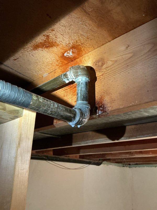 Installed gas line piping utilizing existing infrastructure where feasible and incorporating new 3/4-inch black iron pipe sections. Ran approximately 50 feet of gas line, connecting to available 1-inch or 3/4-inch supply line as determined optimal for the installation. Secured flexible ductwork and piping to ceiling joists using appropriate metal straps and clamps in basement utility area. Installed galvanized elbow fittings to accommodate directional changes in the gas line routing. All materials were staged and coordinated with complete kit installation requirements prior to execution.