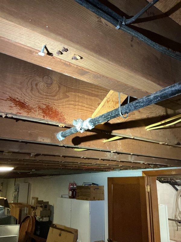 Installed gas line piping utilizing existing infrastructure where feasible and incorporating new 3/4-inch black iron pipe sections. Ran approximately 50 feet of gas line, connecting to available 1-inch or 3/4-inch supply line as determined optimal for the installation. Secured flexible ductwork and piping to ceiling joists using appropriate metal straps and clamps in basement utility area. Installed galvanized elbow fittings to accommodate directional changes in the gas line routing. All materials were staged and coordinated with complete kit installation requirements prior to execution.