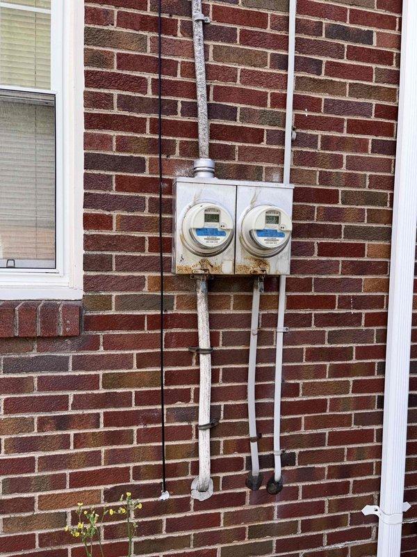 Conducted on-site evaluation for mini-split system installation and electrical panel upgrade. Assessed existing dual-meter electrical infrastructure and aging secondary breaker panel to determine capacity and compatibility requirements for new ductless heat pump system. Documented current electrical service configuration, including conduit routing and available breaker positions, to develop comprehensive installation proposal and ensure proper load calculations for the planned HVAC equipment addition.