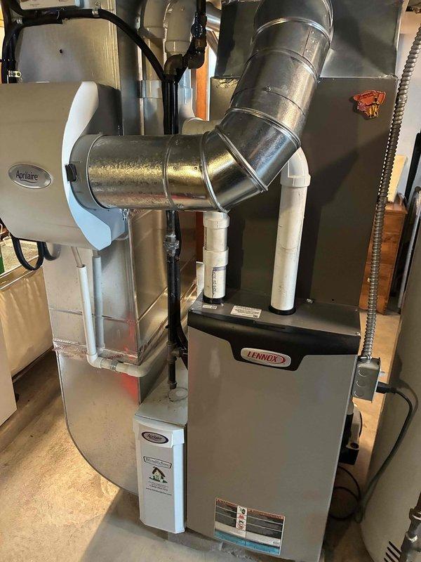 Completed routine MVP cooling maintenance on a 2-year-old Lennox residential HVAC system. Performed comprehensive inspection of outdoor condenser unit and indoor furnace components, verified proper operation of all equipment, and documented system condition through photographic records. All components found to be in good working order with no deficiencies noted.