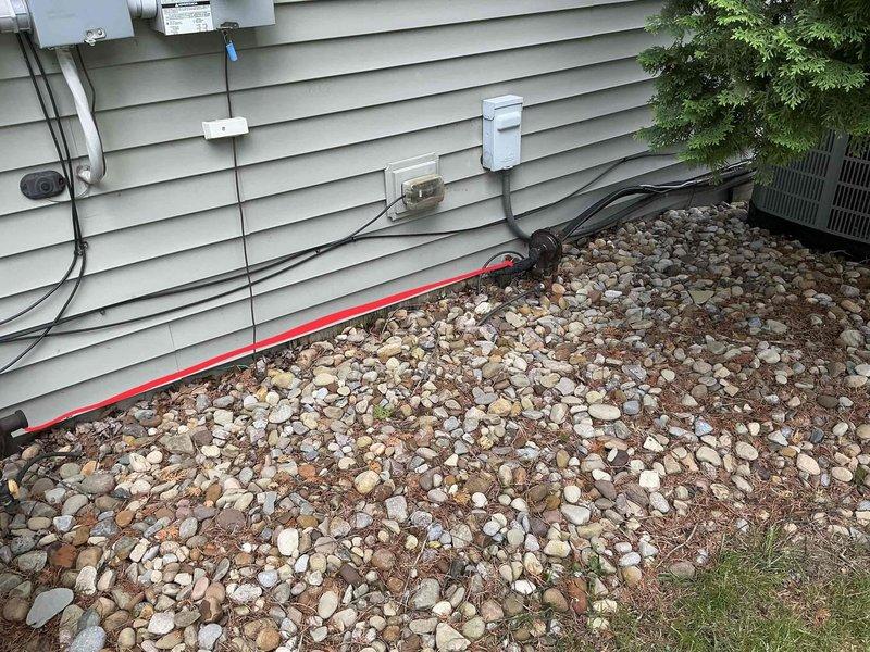 Provided estimate for American Standard Freedom 95 condensing furnace requiring heat exchanger replacement and conversion from liquid propane to natural gas operation. Customer converting entire home to natural gas fuel source. Documented existing equipment condition and installation location in basement utility area with photos showing current configuration, including exterior HVAC components and interior furnace unit with proper venting and drainage systems in place.