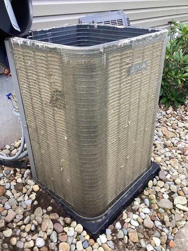 Completed scheduled preventive maintenance cooling visit on one-year-old residential air conditioning system. Performed comprehensive inspection of outdoor condenser unit, verified proper operation of all components including fan motor and compressor, and documented equipment condition with photographs showing unit in satisfactory working order with normal weathering for age.
