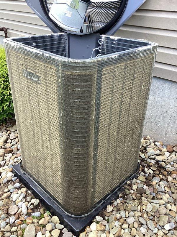 Completed scheduled preventive maintenance cooling visit on one-year-old residential air conditioning system. Performed comprehensive inspection of outdoor condenser unit, verified proper operation of all components including fan motor and compressor, and documented equipment condition with photographs showing unit in satisfactory working order with normal weathering for age.