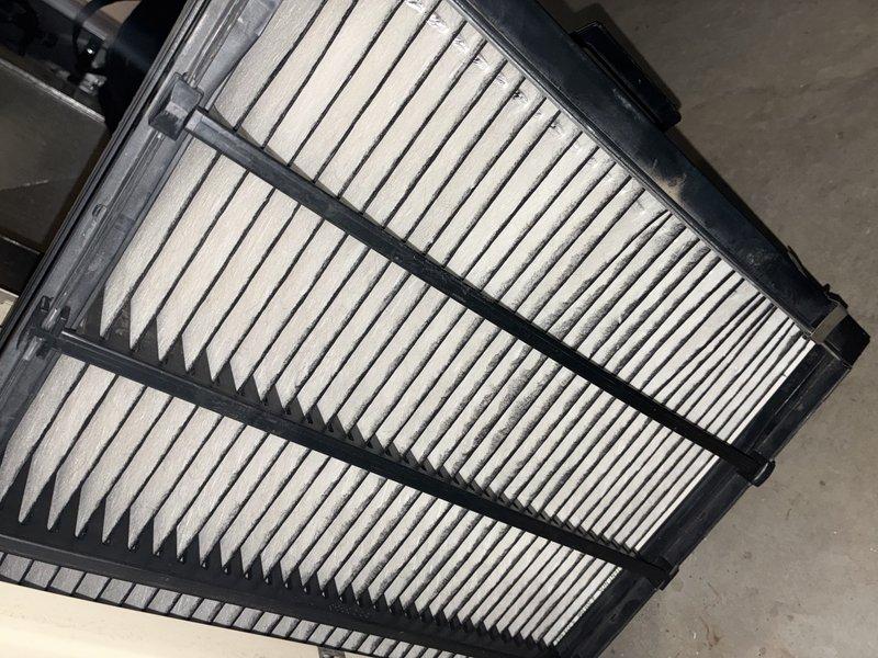 Completed MVP air conditioning maintenance service per customer request. Inspected and documented condition of air filtration system, confirming clean pleated filter media properly seated in housing frame, and examined blower wheel assembly, verifying operational condition of centrifugal fan with all fins intact and functional.