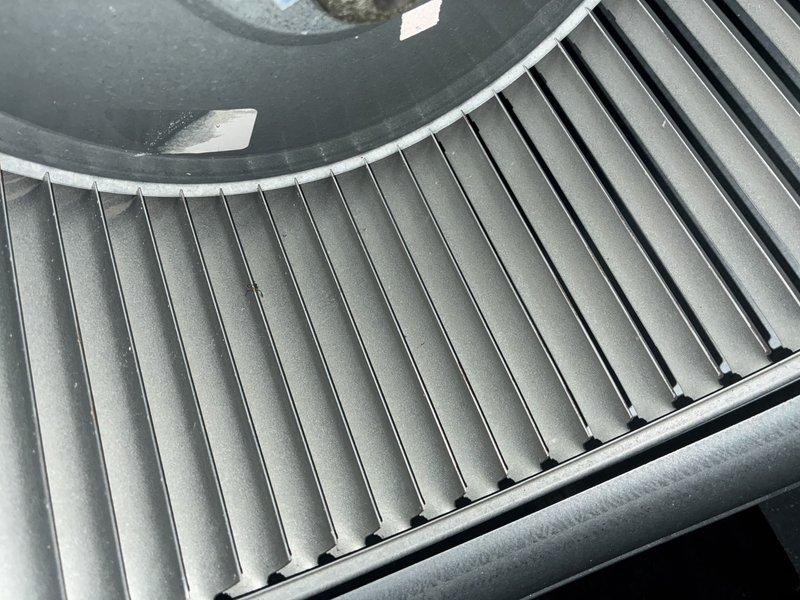 Completed MVP air conditioning maintenance service per customer request. Inspected and documented condition of air filtration system, confirming clean pleated filter media properly seated in housing frame, and examined blower wheel assembly, verifying operational condition of centrifugal fan with all fins intact and functional.