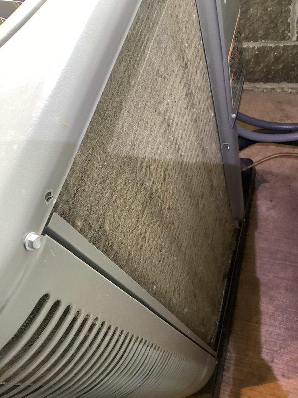 Completed MVP cooling maintenance visit on residential HVAC system. Found heavily contaminated air filter with significant dust and debris accumulation, which was restricting airflow through the air handler unit. Discovered extensive frost buildup on evaporator coil and refrigerant lines, indicating possible low refrigerant charge, restricted airflow from the dirty filter, or system malfunction. Replaced dirty air filter to restore proper airflow. Inspected evaporator coil assembly and refrigerant line connections, noting frost accumulation on copper tubing and service ports. System requires further diagnostic evaluation to determine root cause of icing condition and verify proper refrigerant charge levels.