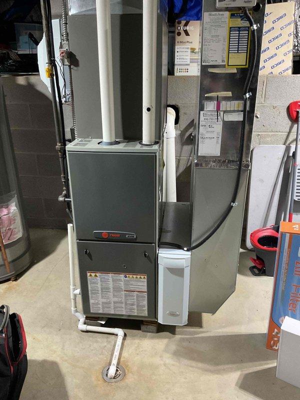 Completed scheduled AC tune-up on 3-year-old residential system. Performed comprehensive maintenance including inspection of Trane furnace and air handler, verified proper operation of all components, checked refrigerant lines and connections, inspected ductwork and PVC condensate drainage system, and confirmed all safety controls and labels were intact. System operating within normal parameters with no issues identified.
