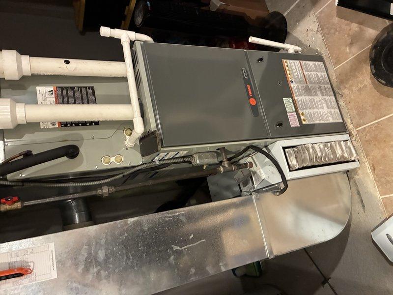 Completed MVP air conditioning maintenance service on residential HVAC system. Performed comprehensive inspection of air handler unit, verified proper operation of control board and electrical components, checked condensate drain lines and PVC piping for proper flow and connections, and confirmed all safety switches and disconnects functioning correctly. System tested and operating within normal parameters upon completion.