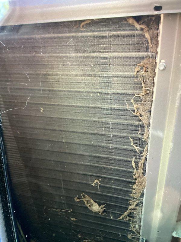 Completed MVP air conditioning maintenance service at 8am as confirmed. Upon inspection, found evaporator coil heavily contaminated with dust, debris, and organic matter buildup, with visible discoloration and possible mold growth on fin surfaces. Thoroughly cleaned and serviced the unit to restore proper airflow and system efficiency. Verified thermostat operation showing 74°F setpoint with proper display function.