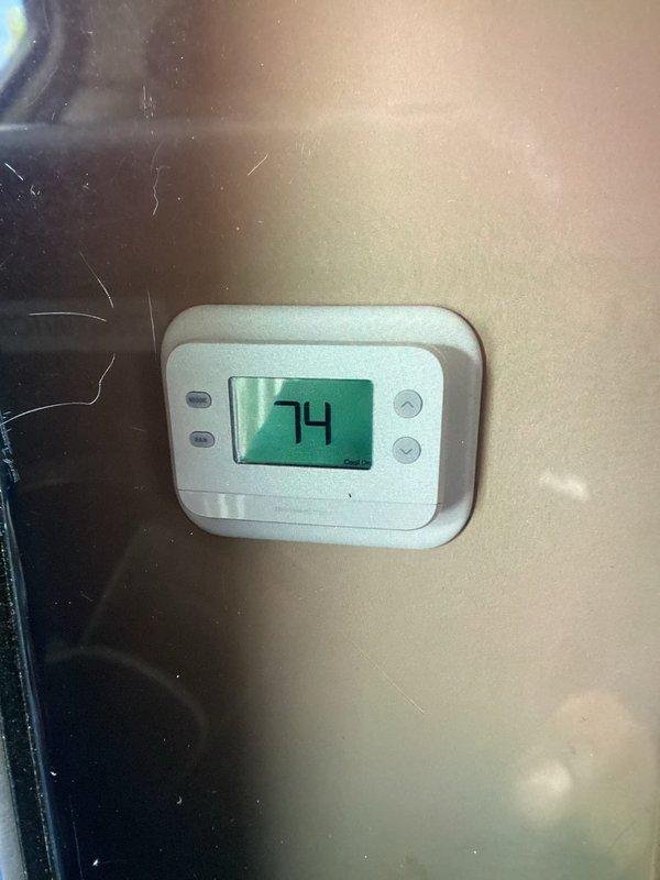 Completed MVP air conditioning maintenance service at 8am as confirmed. Upon inspection, found evaporator coil heavily contaminated with dust, debris, and organic matter buildup, with visible discoloration and possible mold growth on fin surfaces. Thoroughly cleaned and serviced the unit to restore proper airflow and system efficiency. Verified thermostat operation showing 74°F setpoint with proper display function.