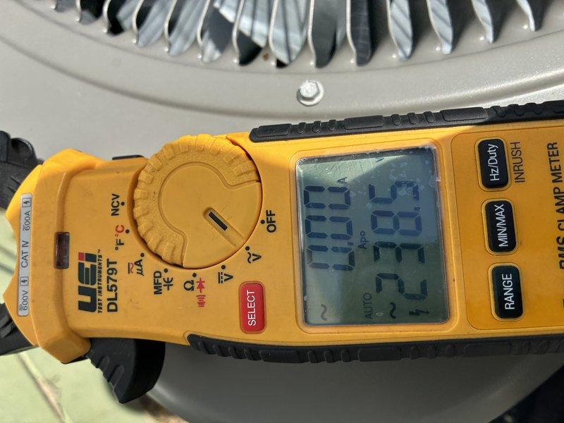 Completed MVP cooling maintenance visit on 2-year-old system. Performed comprehensive system diagnostics using digital clamp meter to verify proper electrical operation and amperage draw. Inspected blower motor assembly and noted significant rust and corrosion present on motor mounting plate, though motor housing and electrical connections remain intact and functional. Documented all electrical readings and component conditions with photographs. Verified colored wire connections (purple, red, yellow) are secure and capacitor is operational. System operating within normal parameters at time of inspection, though corrosion on mounting plate should be monitored for future maintenance planning.