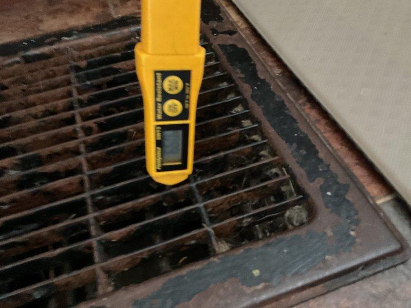 Completed MVP cooling maintenance visit on residential HVAC system. Inspected and photographed dual capacitor with proper wire connections, verified secure mounting bracket, and noted minor moisture accumulation on unit housing consistent with normal condensation. Performed airflow measurement at supply register using digital meter to confirm proper system performance and adequate cooling delivery throughout occupied space.