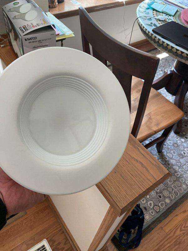 Responded to service call for non-functioning hard-wired interior light fixture. Removed existing recessed lighting fixture and installed new Satco brand replacement unit with white circular trim. Verified proper electrical connections and tested fixture operation to ensure full functionality upon completion.