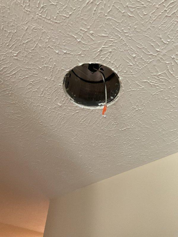 Responded to service call for non-functioning hard-wired interior light fixture. Removed existing recessed lighting fixture and installed new Satco brand replacement unit with white circular trim. Verified proper electrical connections and tested fixture operation to ensure full functionality upon completion.