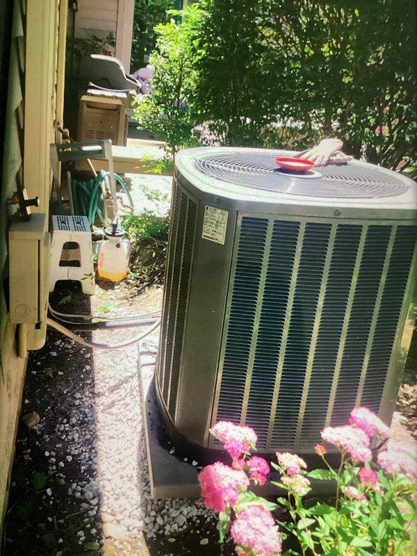 Leveled outdoor condensing unit back to grade using gravel to correct backward lean and ensure proper drainage and operation. Replaced universal turbo capacitor with properly sized OEM capacitor to meet manufacturer specifications. Installed air filter, water panel, and drain tablets to improve indoor air quality and maintain system efficiency.