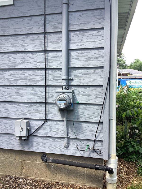 Conducted on-site assessment and provided second quote for complete rewiring of 1400 square foot residential property. Evaluated existing electrical service including exterior meter base, main service entrance conductors, and interior main distribution panel with dual rows of circuit breakers. Documented current electrical infrastructure condition to determine scope of rewiring project.
