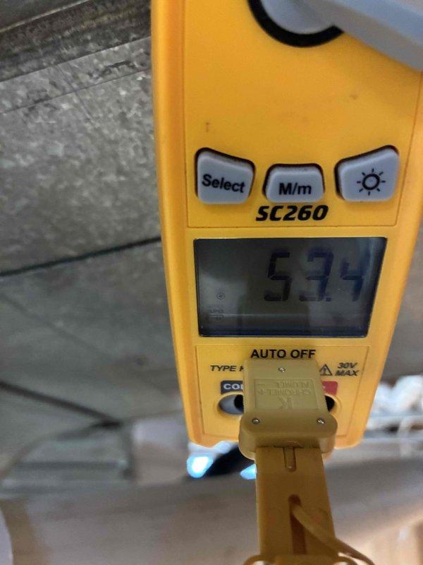 Completed routine AC tune-up on 3-year-old system. Inspected condenser coil and found moderate dirt accumulation and debris between fins with some bent fins affecting airflow; documented current condition with photos showing need for future cleaning to maintain efficiency. Measured supply air temperature at 59.9°F, confirming system is cooling properly and operating within normal parameters.