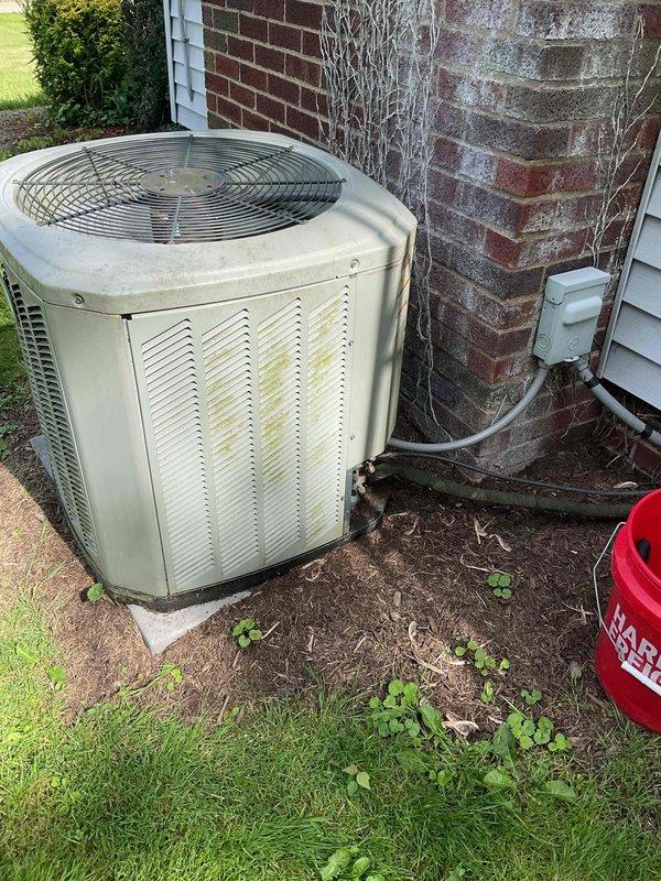 Completed standard AC tune-up on outdoor condensing unit. Performed comprehensive system inspection, checked electrical connections and conduit, verified proper operation of condenser fan, and assessed overall unit condition. Unit showing age-related weathering and discoloration on exterior panels but functioning within normal parameters.