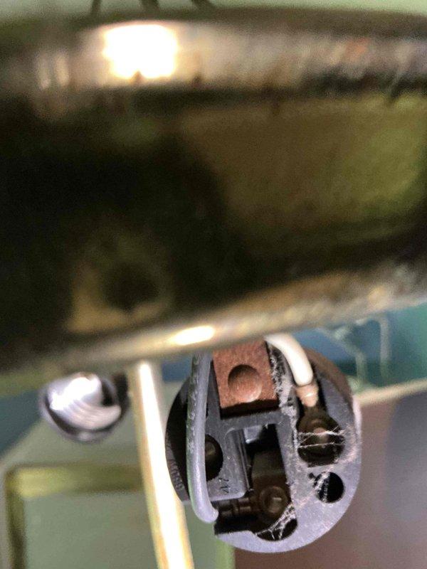 Responded to customer complaint of light fixture producing clicking sounds after being turned off. Upon inspection, identified worn lamp holder socket with loose internal contacts causing thermal contraction noise as components cooled down. Removed defective socket assembly, cleaned mounting hardware and wiring connections, and installed new lamp holder with secure contact points. Verified proper electrical connections, tested fixture operation through multiple on/off cycles, and confirmed elimination of clicking noise. Fixture now operates normally without any audible issues after shutdown.