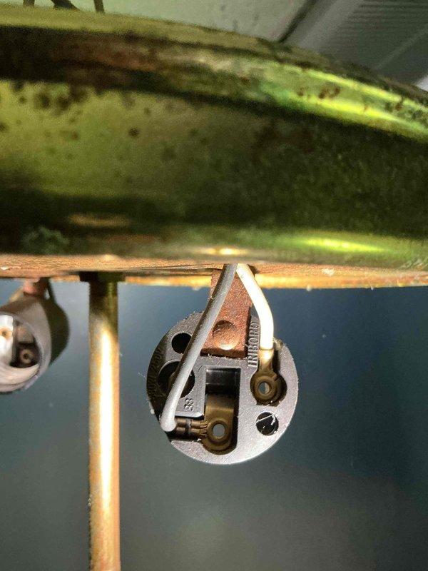Responded to customer complaint of light fixture producing clicking sounds after being turned off. Upon inspection, identified worn lamp holder socket with loose internal contacts causing thermal contraction noise as components cooled down. Removed defective socket assembly, cleaned mounting hardware and wiring connections, and installed new lamp holder with secure contact points. Verified proper electrical connections, tested fixture operation through multiple on/off cycles, and confirmed elimination of clicking noise. Fixture now operates normally without any audible issues after shutdown.