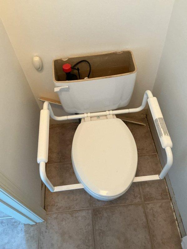 Responded to service call for multiple toilet issues at facility. Assessed one non-functioning toilet with drainage concerns and inspected drain line for blockages or restrictions. Evaluated internal flush mechanisms on three to four additional toilets requiring component replacement. Removed tank lids to examine fill valves, flappers, flush valves, and float assemblies. Documented existing conditions including worn internal components affecting proper flushing operation. Photographed toilet installations showing accessibility grab bar configurations and measured clearances for proper fixture positioning. Identified deteriorated flush valve seals and aging fill valve assemblies requiring replacement to restore proper water flow and flushing performance.