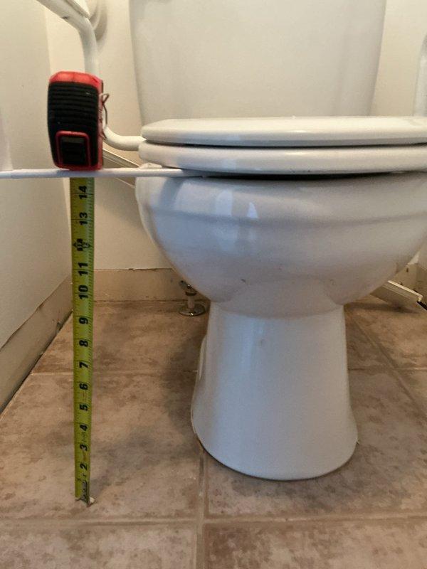 Responded to service call for multiple toilet issues at facility. Assessed one non-functioning toilet with drainage concerns and inspected drain line for blockages or restrictions. Evaluated internal flush mechanisms on three to four additional toilets requiring component replacement. Removed tank lids to examine fill valves, flappers, flush valves, and float assemblies. Documented existing conditions including worn internal components affecting proper flushing operation. Photographed toilet installations showing accessibility grab bar configurations and measured clearances for proper fixture positioning. Identified deteriorated flush valve seals and aging fill valve assemblies requiring replacement to restore proper water flow and flushing performance.