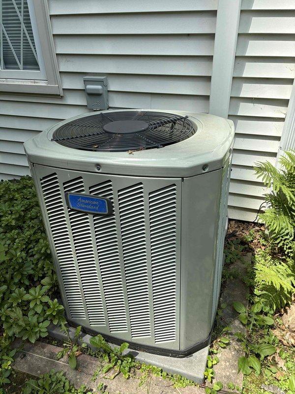 Completed comprehensive cooling maintenance on American Standard outdoor condensing unit. Performed visual inspection of electrical components including dual capacitors, wiring connections, and control systems. Verified proper wire terminations with color-coded conductors and secure wire nut connections. Inspected unit housing, louvered ventilation panels, and fan guard assembly for structural integrity. Noted normal outdoor weathering and minor debris accumulation on base plate. All electrical components found intact and functional. Furnace maintenance was not performed per current service parameters.