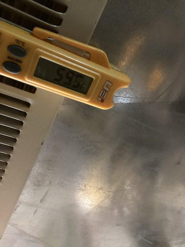 Performed comprehensive air conditioning maintenance on a system at least two years old. Conducted diagnostic testing using digital multimeter to verify electrical readings and measured system temperatures with digital thermometer, recording supply air temperature of 59.2°F. Inspected ductwork for condition assessment and potential cleaning requirements, noting visible wear patterns on metal surfaces and ventilation components.