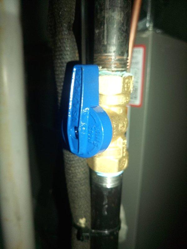 Completed installation of a 90% efficiency furnace and air conditioning system. System was properly charged with R454B refrigerant to manufacturer specifications, with pressures verified at 105.3 psi high side and 25.78 psi low side, and temperatures reading 39.2°F and 89.3°F on digital manifold gauges. Installed brass ball valve with blue handle on water supply line for proper system isolation and maintenance access.
