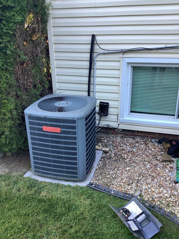 Completed full HVAC system installation including 90% efficiency Goodman furnace and matching air conditioning unit. Installed outdoor condenser on concrete pad with proper refrigerant line set and electrical disconnect, secured all penetrations through exterior siding, and connected system to existing ductwork. Interior installation included furnace placement in basement mechanical room with appropriate venting configuration using PVC piping for intake and exhaust. All electrical connections, thermostat wiring, and startup procedures were completed per manufacturer specifications, with system tested and verified operational.