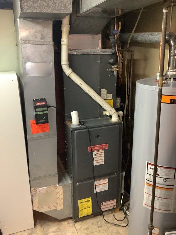 Completed full HVAC system installation including 90% efficiency Goodman furnace and matching air conditioning unit. Installed outdoor condenser on concrete pad with proper refrigerant line set and electrical disconnect, secured all penetrations through exterior siding, and connected system to existing ductwork. Interior installation included furnace placement in basement mechanical room with appropriate venting configuration using PVC piping for intake and exhaust. All electrical connections, thermostat wiring, and startup procedures were completed per manufacturer specifications, with system tested and verified operational.