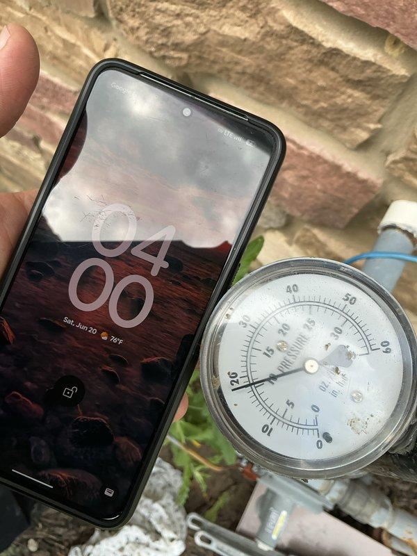 Responded to gas pressure concern following gas company valve seal replacement. Performed diagnostic pressure test on gas line from meter to house, which failed to hold proper pressure. Documented pressure gauge readings with time-stamped photos showing system unable to maintain required PSI levels. Customer advised to contact gas company for follow-up repair of compromised gas line system.