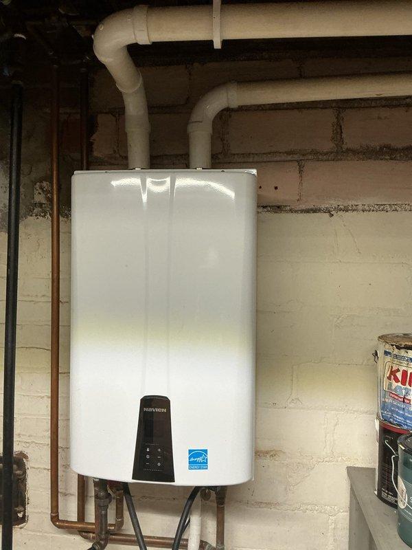 Performed descaling maintenance on tankless water heater in 96-year-old residential property. Unit was inspected and confirmed to be operating properly following the descaling procedure. Additionally provided pricing estimate to customer for replacement of main water shut-off valve with quarter-turn ball valve, as existing gate valve showed signs of age and corrosion consistent with the home's plumbing infrastructure.