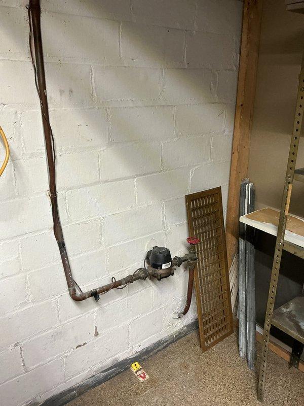 Performed descaling maintenance on tankless water heater in 96-year-old residential property. Unit was inspected and confirmed to be operating properly following the descaling procedure. Additionally provided pricing estimate to customer for replacement of main water shut-off valve with quarter-turn ball valve, as existing gate valve showed signs of age and corrosion consistent with the home's plumbing infrastructure.