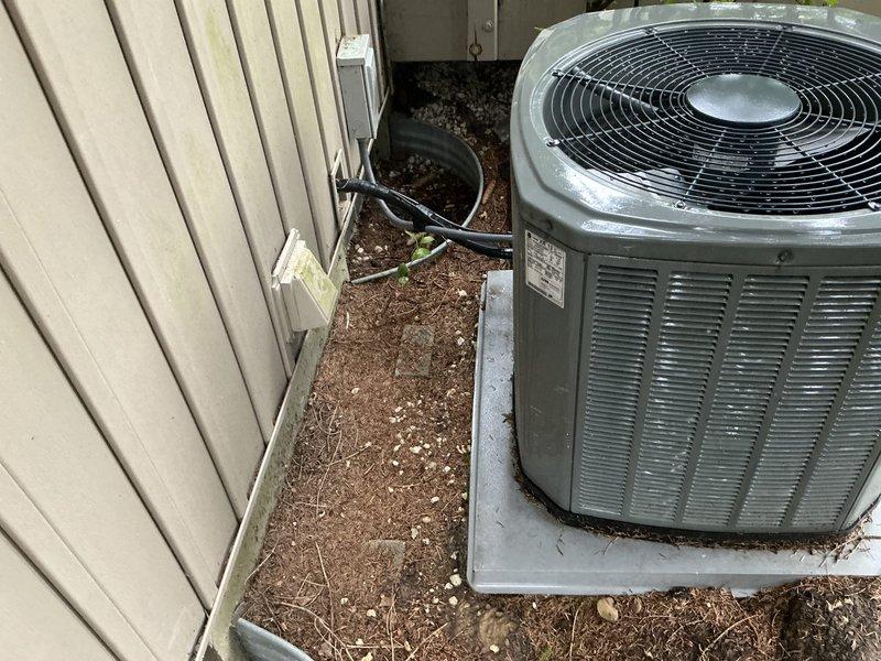 Conducted estimate for complete HVAC system replacement on 14-year-old Trane unit. Assessed existing outdoor condenser unit with weathered concrete pad and indoor air handler configuration with water heater in utility space. Documented current system condition, equipment specifications, and installation requirements for proposed replacement system.