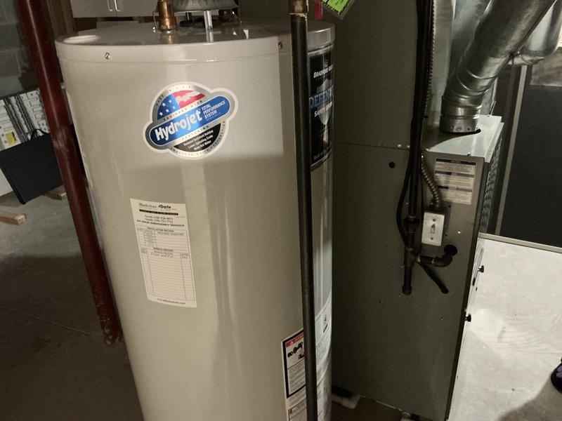 Conducted estimate for complete HVAC system replacement on 14-year-old Trane unit. Assessed existing outdoor condenser unit with weathered concrete pad and indoor air handler configuration with water heater in utility space. Documented current system condition, equipment specifications, and installation requirements for proposed replacement system.