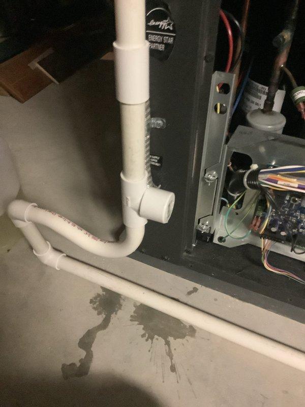 Completed MVP recurring cooling maintenance on two HVAC units. During inspection, discovered active water leakage from condensate drain line with visible pooling on floor beneath horizontal PVC piping section. Addressed drainage issue, inspected condensate trap and drain line connections, verified proper operation of both systems, and confirmed all electrical components and controls functioning correctly.
