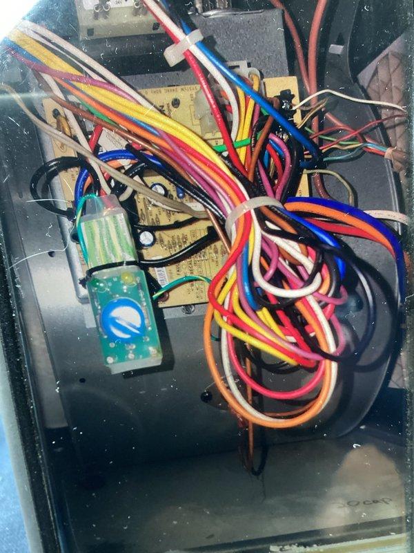 Performed comprehensive system evaluation on ten-year-old cooling system currently operating normally. Identified outdoor unit capacitor testing below acceptable tolerance levels, requiring replacement to prevent system failure and loss of cooling capacity. Recommended chemical cleaning of evaporator coil, condenser coil, and blower wheel to remove debris and bacterial growth, improve indoor air quality, and restore system efficiency per manufacturer maintenance guidelines. Advised installation of drain tablets in evaporator pan to sanitize system and prevent PVC drain line clogs caused by bacteria and calcium buildup. Recommended surge protection device installation on circuit board to protect against electrical damage from power surges and outages. Suggested compressor hard start kit installation to reduce compressor wear and improve electrical efficiency. Documented system conditions with photographs of outdoor unit components and electrical control panel wiring. All required replac