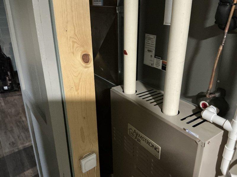 Conducted furnace replacement estimate at residential property. Evaluated existing Armstrong air handler unit and associated HVAC system components in basement mechanical room. Documented current equipment configuration including high-efficiency furnace with PVC intake and exhaust venting, water heater, copper and gas piping infrastructure, and overall system layout to provide comprehensive replacement recommendations.