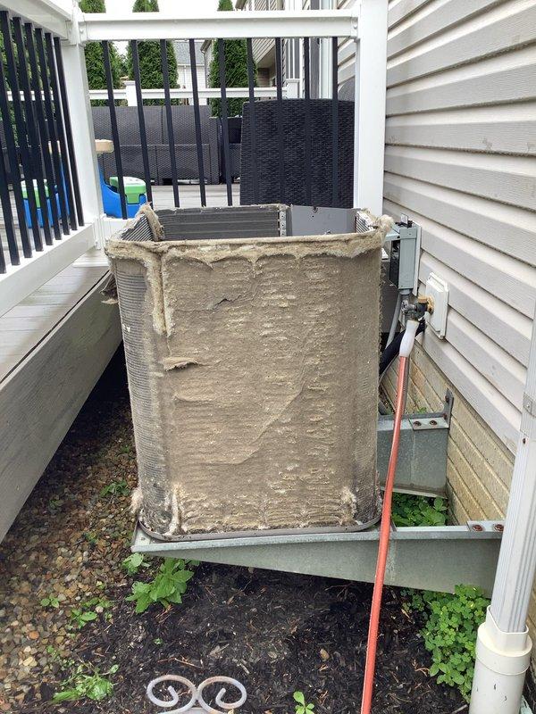 Responded to no cooling call on 15-year-old Lennox system where indoor blower was operational but outdoor unit failed to run. Upon arrival, performed diagnostic evaluation of condensing unit located in side yard between structures. Removed exterior panels to access internal components and discovered evaporator coil assembly completely obstructed with heavy accumulation of dirt, dust, and debris buildup. The severe blockage prevented proper airflow and heat transfer, causing system failure and inability to cool the residence.

Performed thorough coil cleaning to remove dense layer of contaminants from fin surfaces using appropriate cleaning methods and solutions. Cleared all debris from coil assembly to restore proper airflow capacity. Inspected electrical connections, capacitor, and contactor for proper operation. Verified compressor and fan motor functionality after cleaning was completed.

Reinstalled exterior panels and secured unit. Energized system and confirmed outdoor unit opera