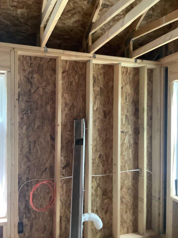 Conducted site assessment for mini split installation in new addition space currently under construction. Evaluated framing structure, existing electrical rough-in, and ventilation requirements to determine optimal equipment placement and line set routing for climate control system serving the workspace area.