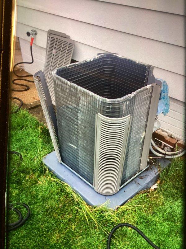 Performed preventative maintenance on outdoor condensing unit including thorough coil cleaning and drain treatment. Condenser coils showed moderate dirt accumulation and were pressure washed to restore optimal airflow and heat transfer efficiency. Applied drain pan treatment tablets to prevent algae growth and maintain proper condensate drainage. All components inspected and found operating within normal parameters. Service completed using truck stock materials with no additional parts required.