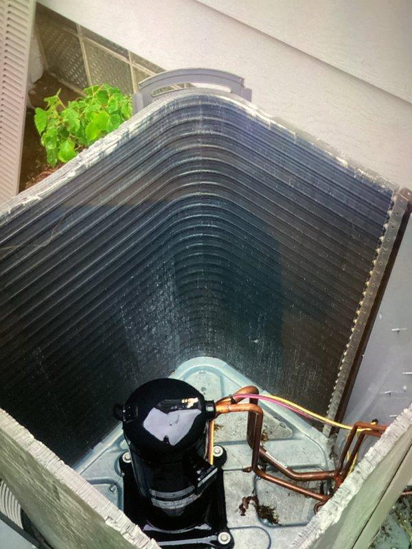 Performed preventative maintenance on outdoor condensing unit including thorough coil cleaning and drain treatment. Condenser coils showed moderate dirt accumulation and were pressure washed to restore optimal airflow and heat transfer efficiency. Applied drain pan treatment tablets to prevent algae growth and maintain proper condensate drainage. All components inspected and found operating within normal parameters. Service completed using truck stock materials with no additional parts required.