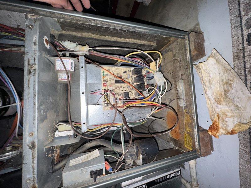 Completed comprehensive tune-up on 7-year-old residential air conditioning system. Performed thorough inspection of outdoor condenser unit, noting significant debris accumulation within fin coil assembly requiring attention. Assessed electrical control panel and wiring connections, documenting existing installation condition. All critical components evaluated for proper operation and seasonal readiness.