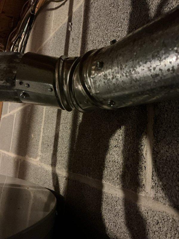 Completed warranty repair following failed inspection. Installed required drain pan and secured flue pipe connections with three screws per code requirements. Documented all repairs with photographs and notified permits department for re-inspection scheduling.