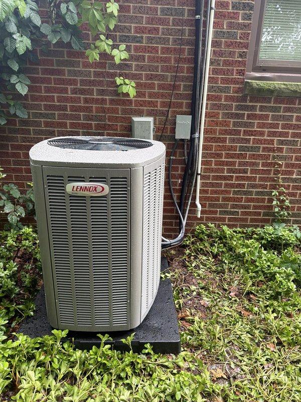 Completed full HVAC system installation including outdoor Lennox condensing unit and attic-mounted air handler. Installed new drain pan for air handler as required, mounted outdoor unit on composite pad against exterior brick wall, and ran electrical conduit and refrigerant lines between components. Installed FLNR 30 amp fuses in disconnect box, verified all electrical connections, and tested system operation to ensure proper cooling performance.