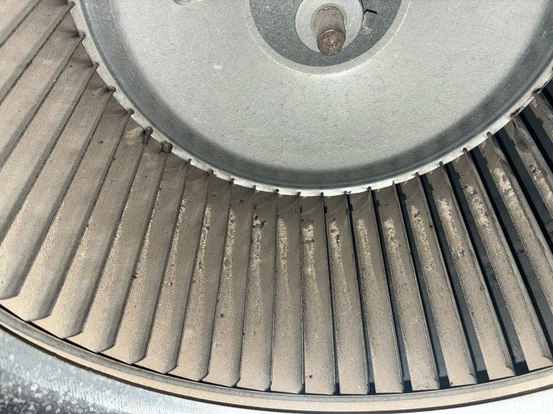 Completed MVP air conditioning maintenance service. Inspected and documented condition of blower wheel assembly, noting dust accumulation on centrifugal fan blades and normal operational wear. Examined evaporator coil, identifying debris buildup between fins and minor fin damage with compression in middle sections requiring monitoring for airflow efficiency.